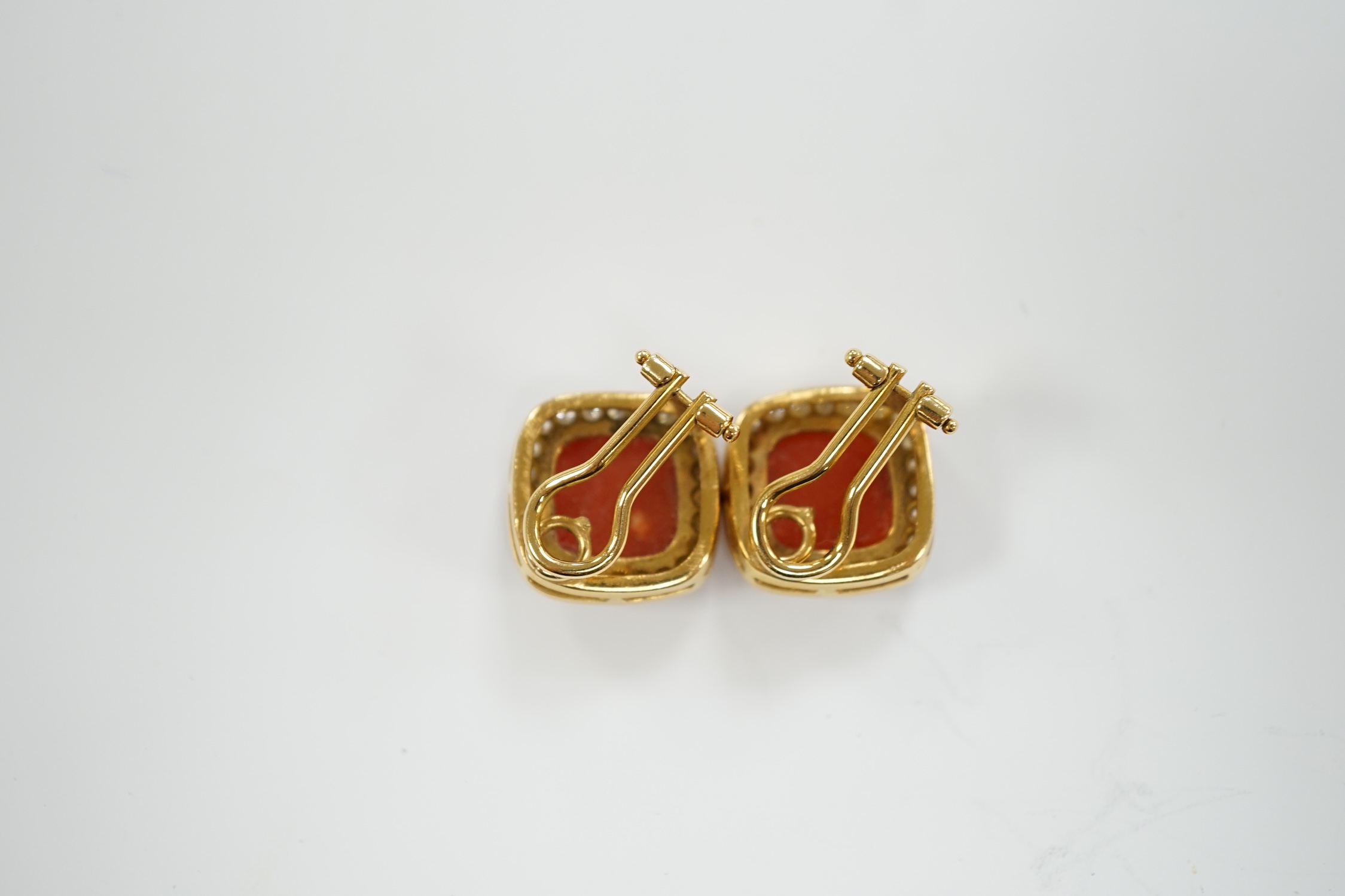 A pair of Italian 750 yellow metal, coral and diamond cluster set ear clips, 17mm, gross weight 15.6 grams.